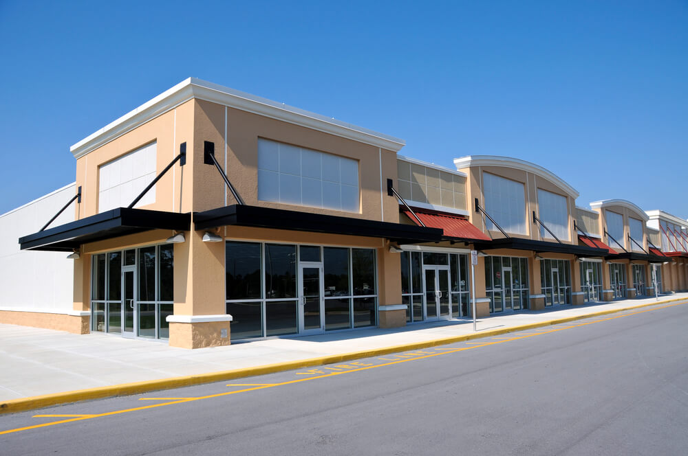 A block of commercial store fronts with no logos or shop names