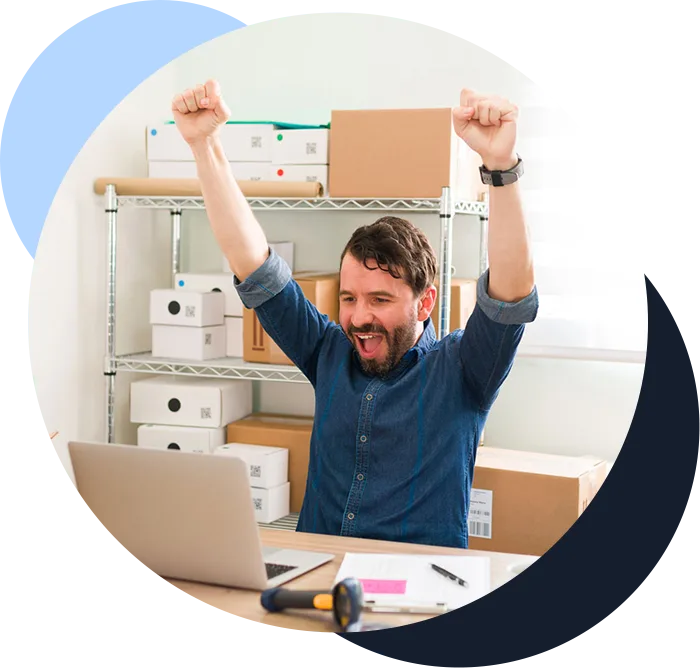 Successful and excited young man celebrating getting a lot of customers orders on his thriving fashion clothing online shop