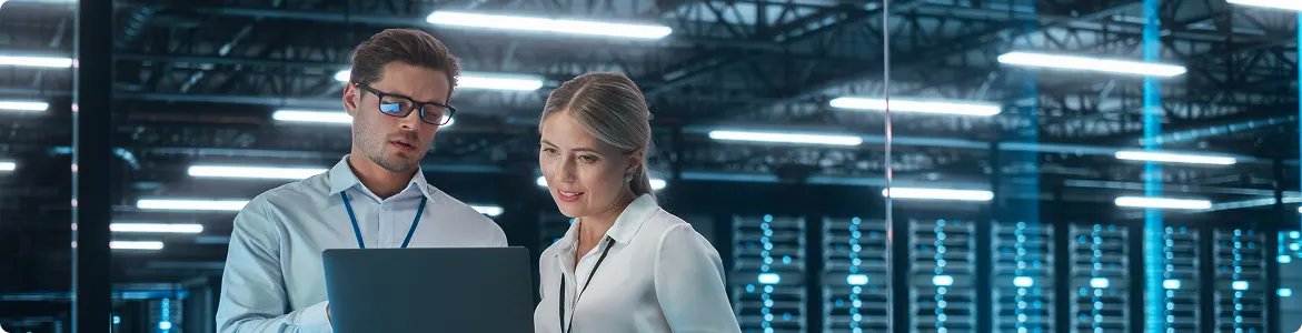 Female Chief Engineer Talks with Electronics Specialist, Explaining Things, While Works on Laptop Computer and Agrees with Her.