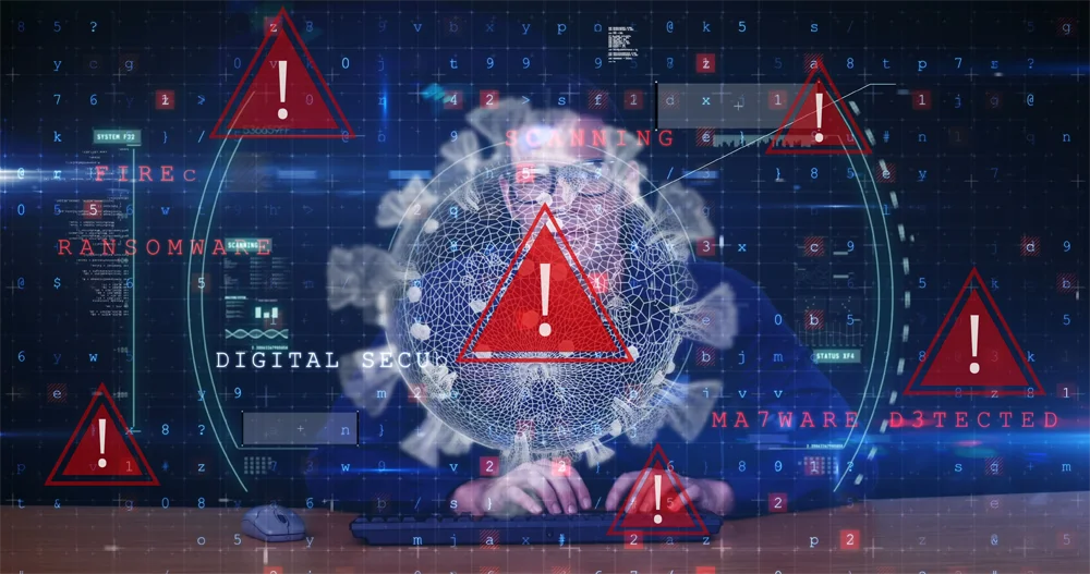 Alert icons and cybersecurity warnings overlay a person working on a computer, with prominent red warning triangles and messages about malware, ransomware, and digital security.