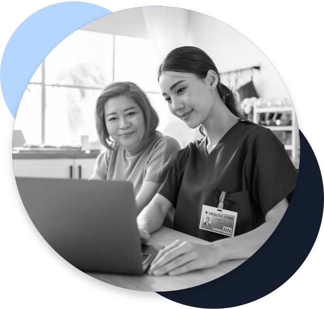 home health nurse helping a patient look something up on a laptop