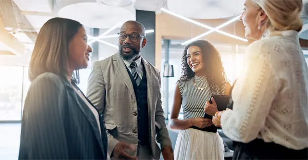 Discussion, smile and business people in lobby