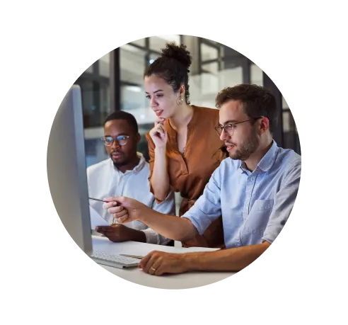 Team, office and computer in night workshop for planning, strategy or goal for business in overtime. Collaboration, teamwork and meeting at desk for creative vision, innovation or idea late at work