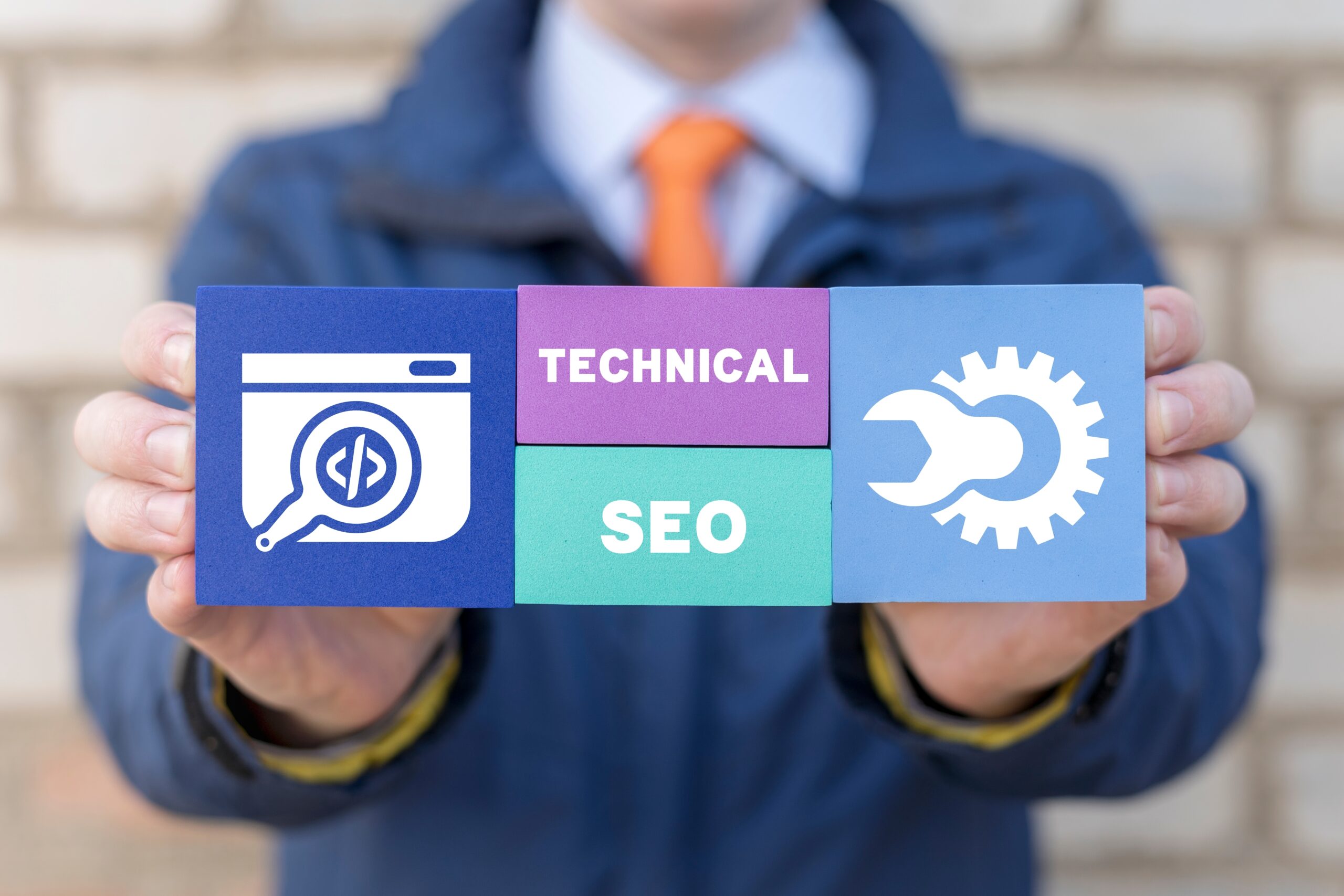 Someone holding up cards that have images and text about Technical SEO