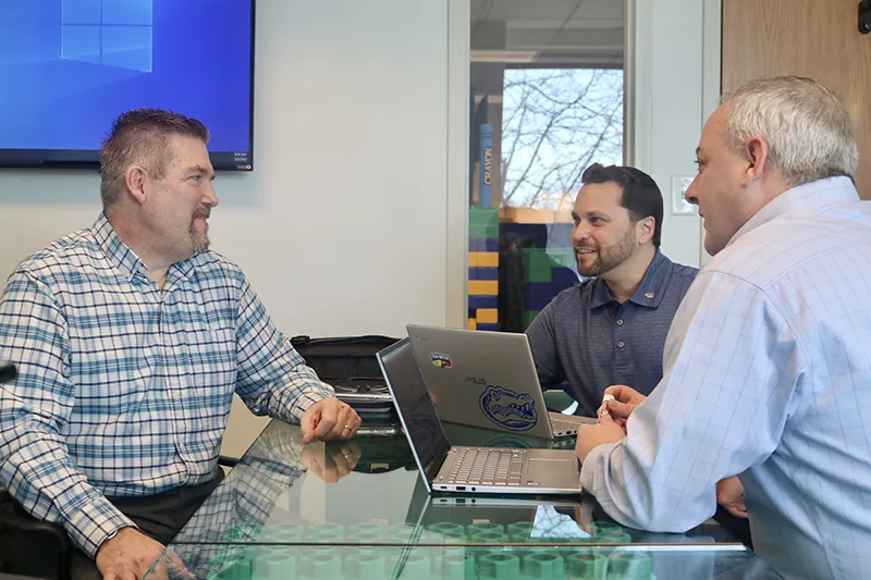 Software team leadership during a roundtable discussion presenting ideas and solutions